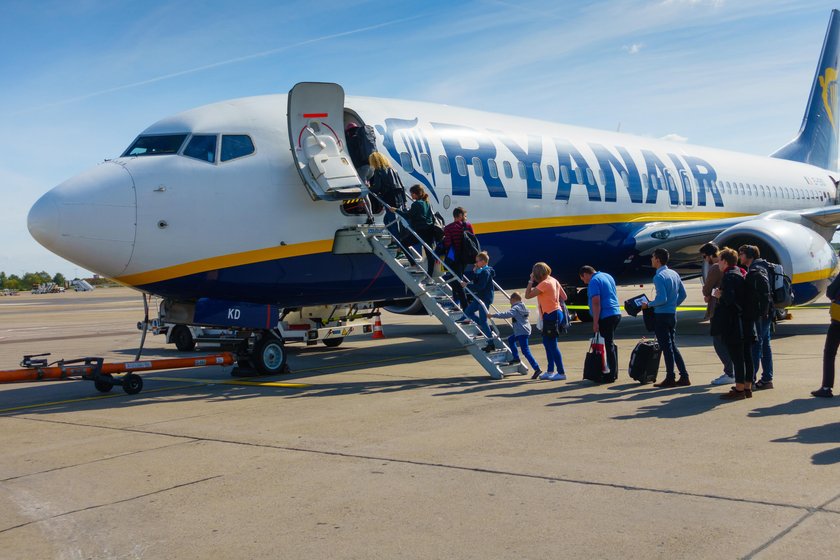 Passengers boarding on the aircraft of low cost airline company Ryanair