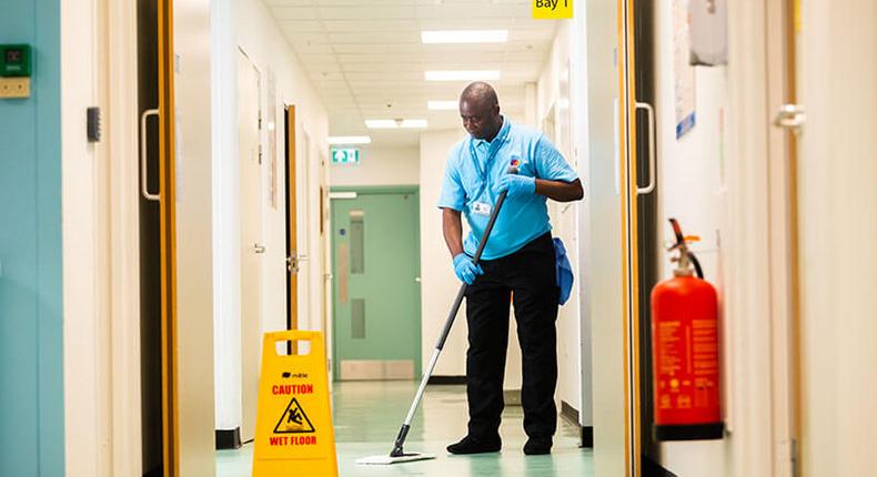 Hospital-cleaner-mopping-floor