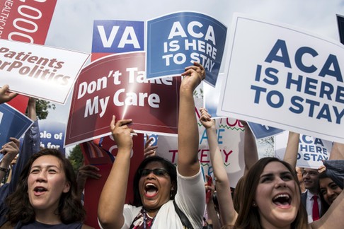 Supporters of the Affordable Care Act celebrate after the Supreme Court up held the law in the 6-3 v