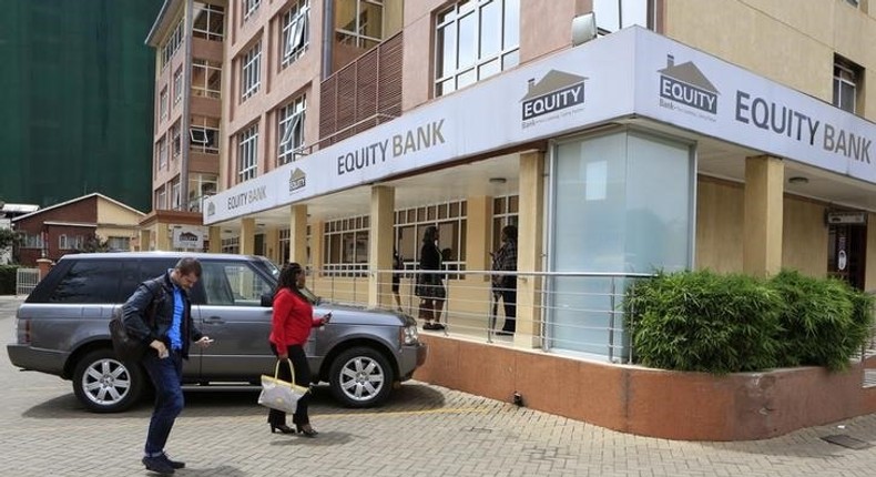 Customers arrive at a branch of the Equity Bank for money transactions in Kenya's capital Nairobi November 11, 2015. 