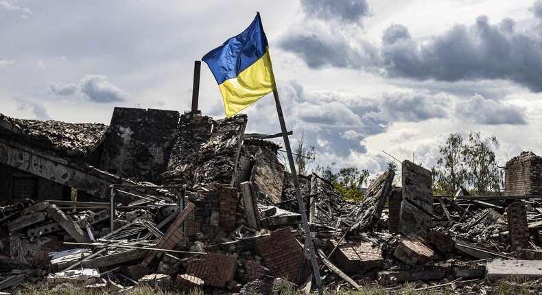 A Ukrainian flag waves in the village of Dolyna in Donetsk oblast, Ukraine after the withdrawal of Russian troops on September 24, 2022.