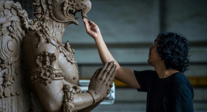 The sculptures include the Hindu god Brahma, elephants, lions and a towering Garuda -- a half-bird, half-human creature of Hindu and Buddhist lore which will carry Bhumibol's spirit