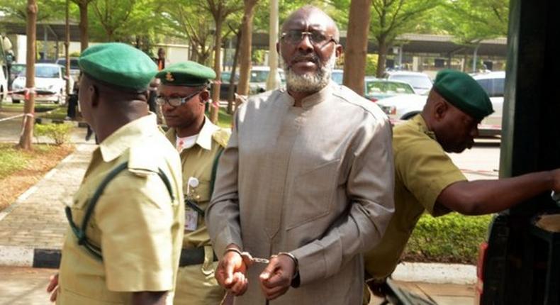 Olisa Metuh arrives Abuja court in handcuffs on January 19, 2016.