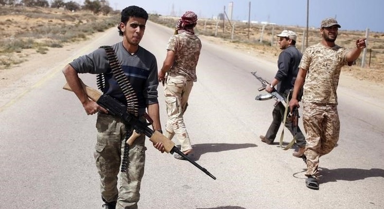 Libya Dawn fighters search for Islamic State militant positions during a patrol near Sirte March 17, 2015. REUTERS/Goran Tomasevic