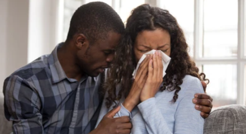 File photo: Man consoles weeping woman (Credit: Shutterstock)