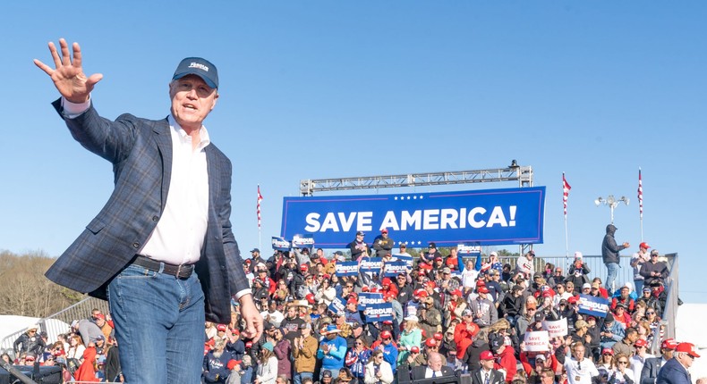 Former U.S. Senator and Republican candidate for Governor of Georgia David Perdue waves to supporters of former U.S. President Donald Trump after speaking at a rally at the Banks County Dragway on March 26, 2022 in Commerce, Georgia.