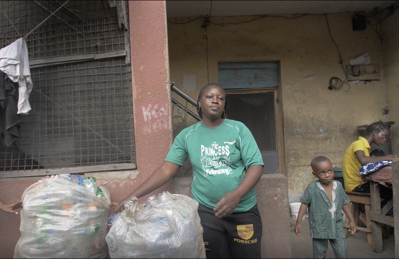 Mrs Balikis Muritala with stored pet bottles ahead of school resumption in May 