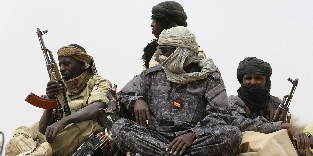 Chadian soldiers ride atop a pickup truck during Flintlock 2015, an American-led military exercise, in Mao on February 23, 2015.