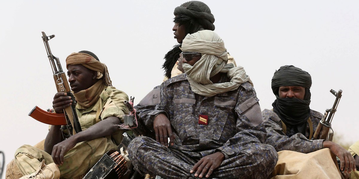 Chadian soldiers ride atop a pickup truck during Flintlock 2015, an American-led military exercise, in Mao on February 23, 2015.