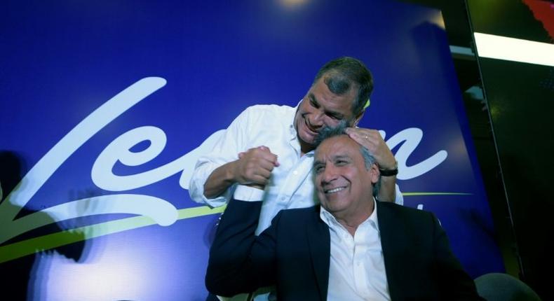 Ecuadorian President Rafael Correa (L) hugs Lenin Moreno, the presidential candidate of the governing Alianza PAIS party, February 19, 2017