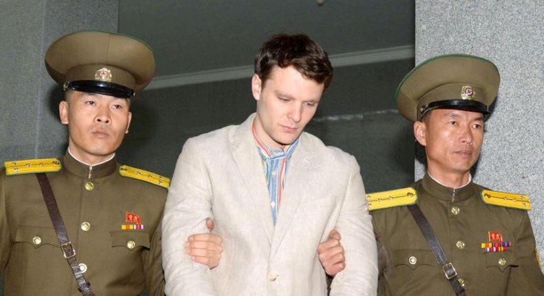 FILE PHOTO - Otto Frederick Warmbier (C), a University of Virginia student who was detained in North Korea since early January, is taken to North Korea's top court in Pyongyang, North Korea, in this photo released by Kyodo March 16, 2016.        Mandatory credit REUTERS/Kyodo/File Photo