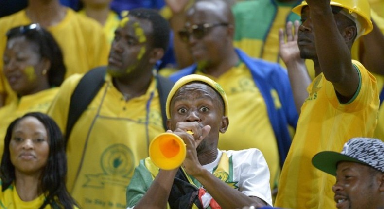 A South African Mamelodi Sundowns' football club fan blows a vuvuzela prior to the start of the CAF Champions League final match on October 23, 2016 at the Army stadium in Borg el-Arab, near Alexandria