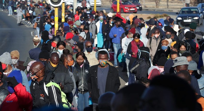 Pedestrians wearing masks in South Africa.