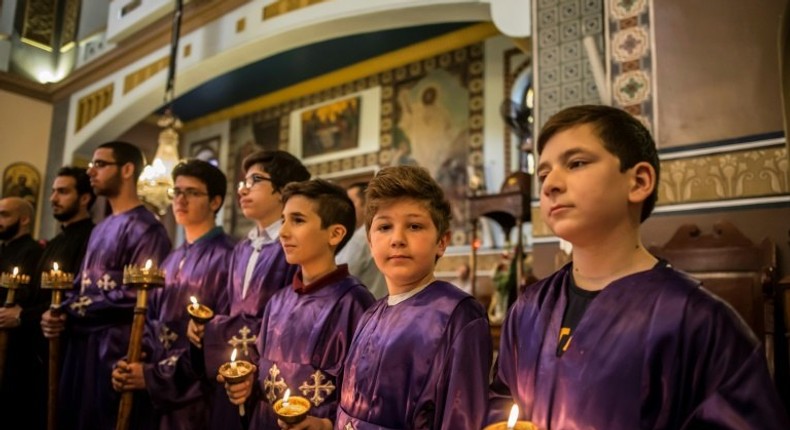 Egyptian Christians observe a solemn Good Friday at the Archangels Greek Orthodox Church in the capital Cairo, on April 14, 2017, as the community reels from deadly church bombings