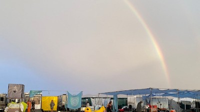 A rainbow formed over a muddy Burning Man.Veloci-crafter