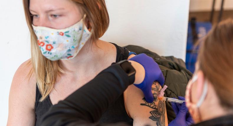 A healthcare worker receives a Moderna COVID-19 vaccination at a clinic in Livingston, Montana, on January 5.