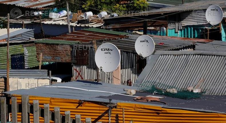 Satellite dishes connect township residents to South Africa's DSTV television network, owned by telecommunications giant Naspers, in Khayelitsha township, Cape Town, May 19, 2017. 