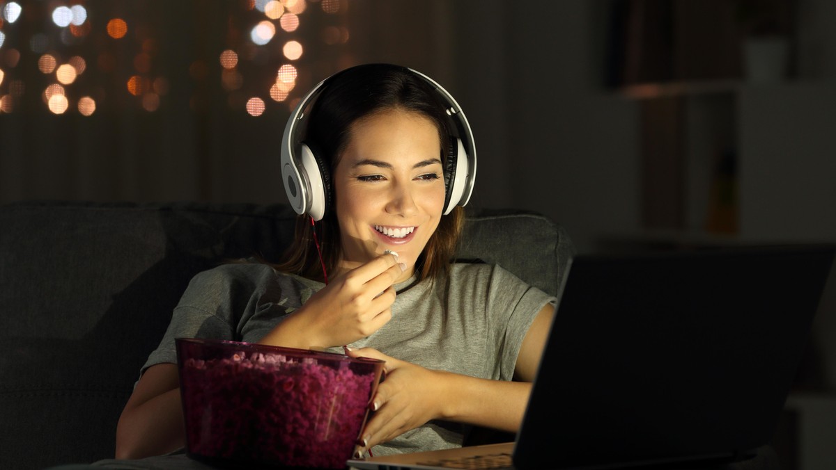 Woman watching online tv in the night