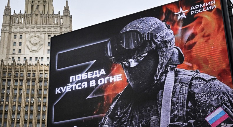 The Russian Foreign Ministry building is seen in central Moscow behind a billboard featuring Z letters — a tactical insignia for Russian troops in Ukraine. The billboard reads: Victory is being Forged in Fire.ALEXANDER NEMENOV/AFP via Getty Images