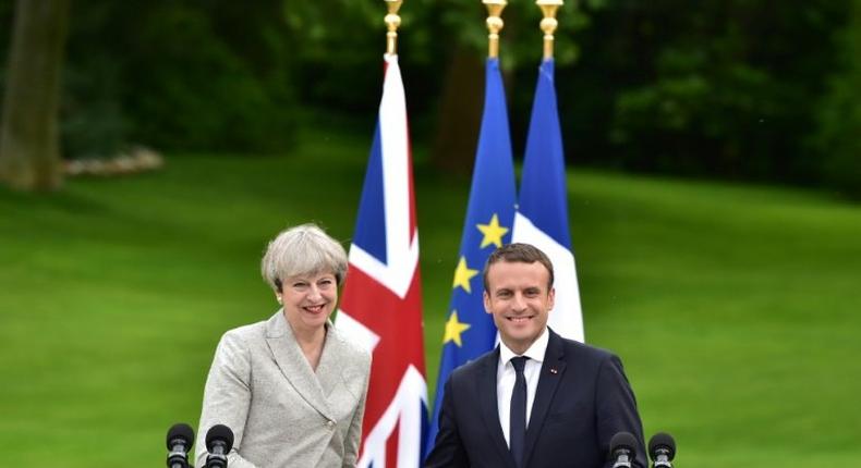 Britain's Prime Minister Theresa May (L) and France's President Emmanuel Macron meet at The Elysee Palace in Paris on June 13, 2017