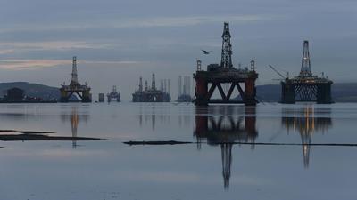 Drilling rigs are parked up in the Cromarty Firth near Invergordon, Scotland