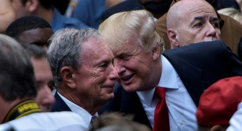 Then US Republican presidential nominee Donald Trump (R) speaks to former New York mayor Michael Bloomberg during a memorial service at the National 9/11 Memorial in New York on September 11, 2016