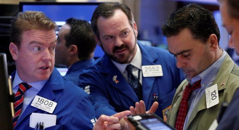 A trader works on the floor of the NYSE