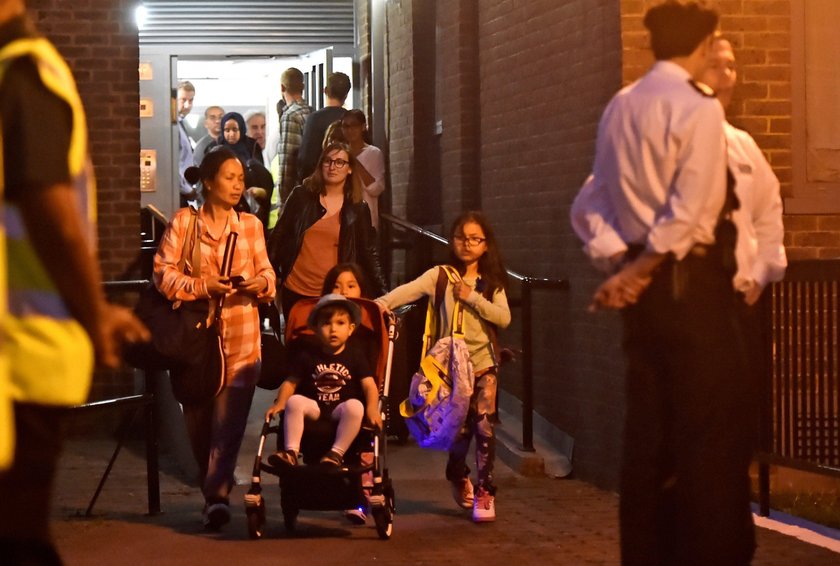 Residents are evacuated from the Taplow Tower residential block as a precautionary measure following