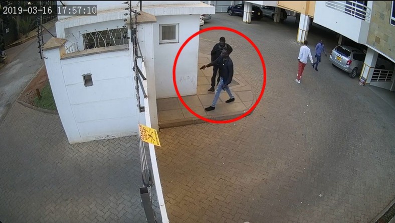 Man hunt for foreigner captured on video threatening to shoot security guard