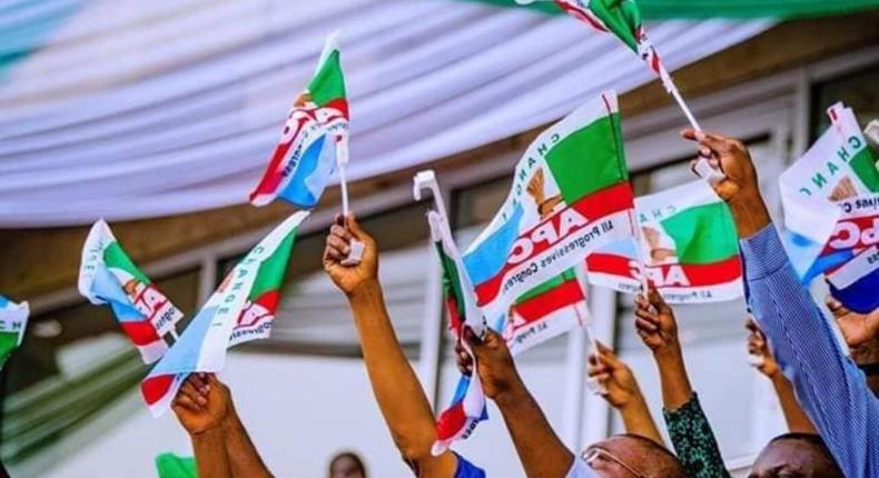 APC members holding party flag (PeoplesGazette)