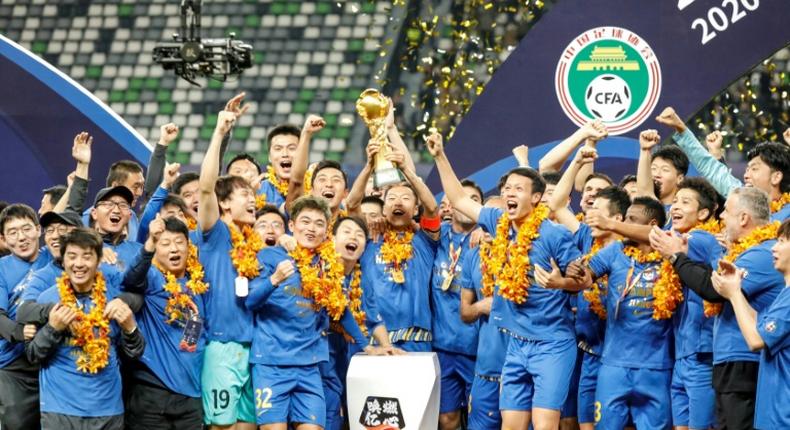 Jiangsu Suning celebrate beating Guangzhou Evergrande to win the Chinese Super League last month, but both clubs may have to change their names for next season