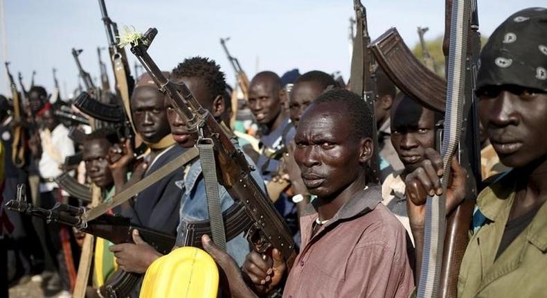 A file photo shows Jikany Nuer White Army fighters holding their weapons in Upper Nile State, South Sudan