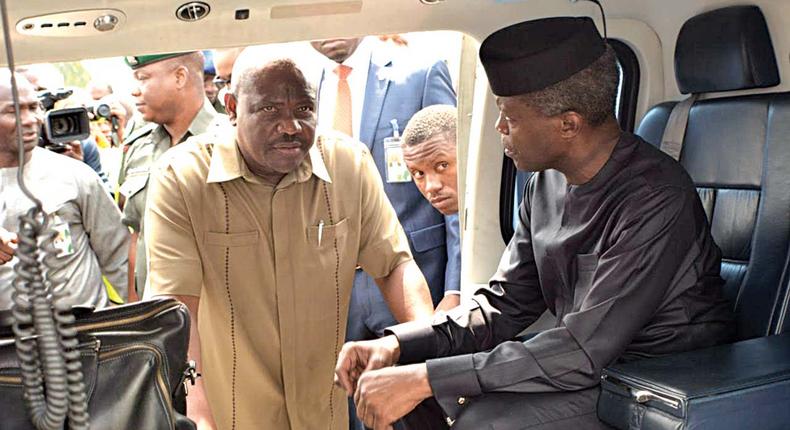 Acting President, Prof Yemi Osinbajo discussing with Rivers State Governor Nyesom Wike at the Port Harcourt International Airport