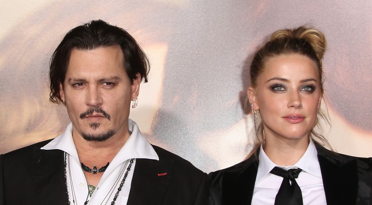 Amber Heard és Johnny Depp a Dán lány premierjén