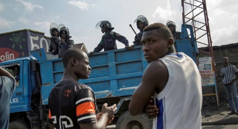 Police patrol in the neighbourhood of Majengo after people attempted to block the road with rocks, in Goma, eastern Democratic Republic of the Congo, on December 19, 2016