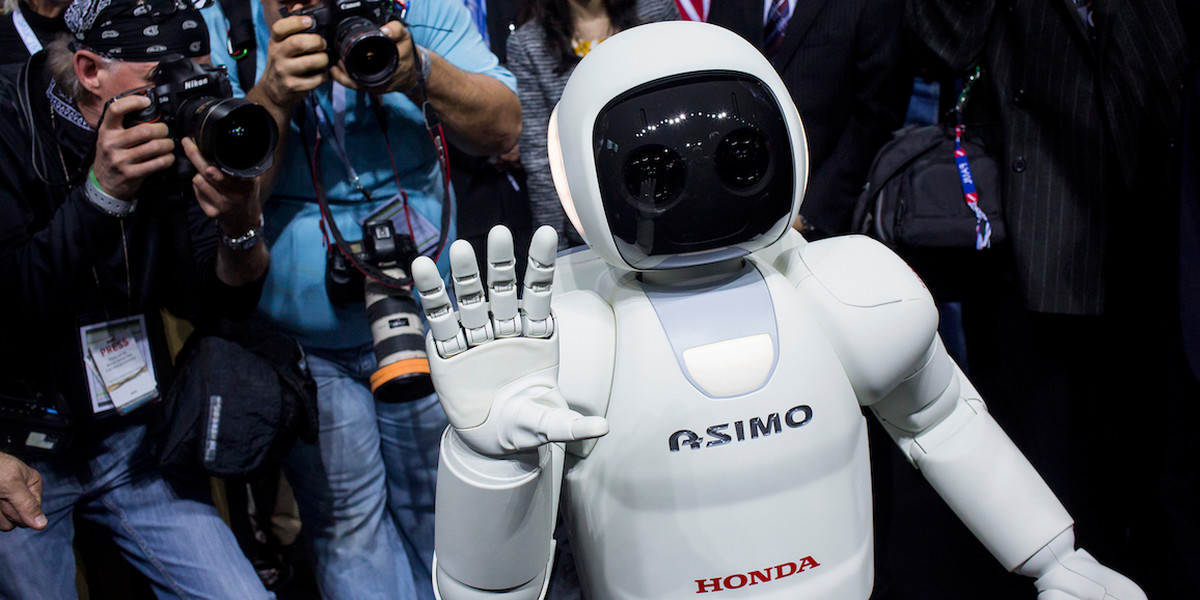 Honda Motors demonstrates its Asimo robot during a media preview of the 2014 New York International Auto Show.
