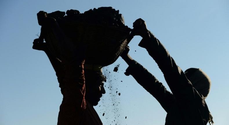 The collapse of a coal mine in eastern India has left around a dozen workers trapped