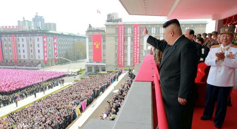 An official Korean Central News Agency image shows leader Kim Jong-Un waving to people after the military parade in Pyongyang on on April 16, 2017