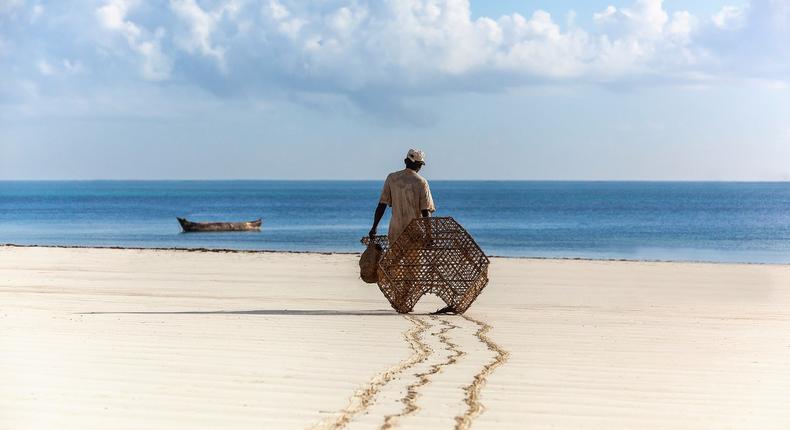 A local fisherman heading to the Indian Ocean to lay his fish traps in Kwale County.