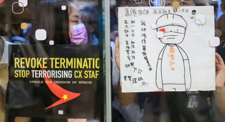 Airliner Cathay has been put in a bind over whether to allow its staff to take part in demonstrations