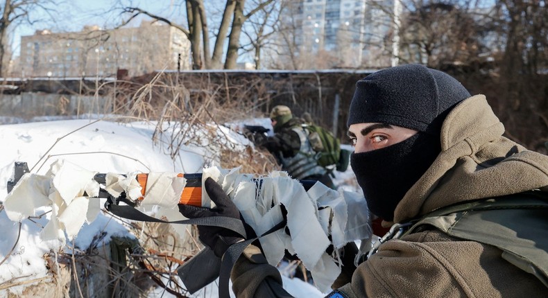 People take part in a military exercise for civilians conducted by members of the Georgian National Legion paramilitary volunteer unit amid threat of Russian invasion in Kyiv, Ukraine February 4, 2022.