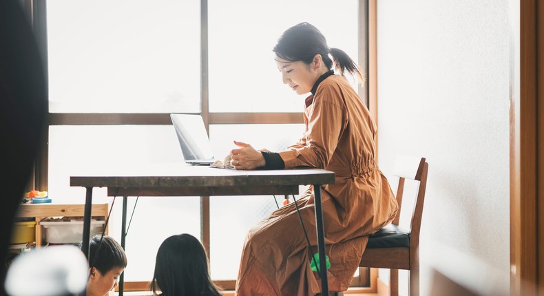 woman working at home with kids