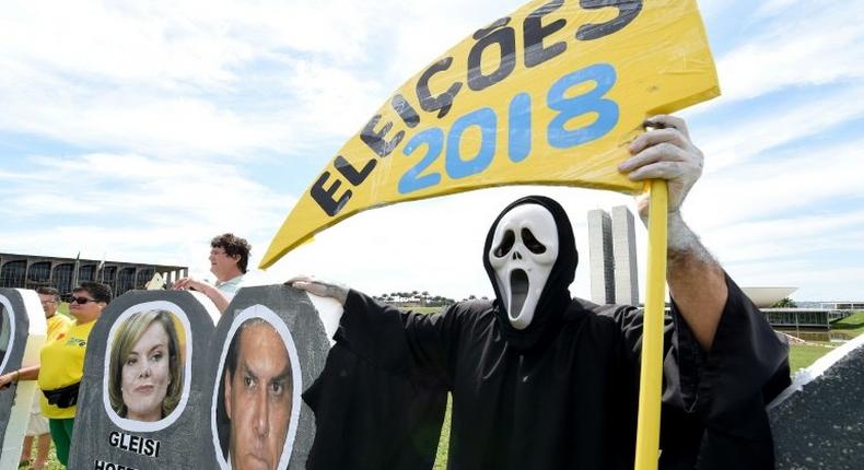 Protester attend a rally against corruption in Brasilia on March 26, 2017