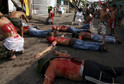 Flagellants pray in front of a chapel in during a Holy Week ritual in Angeles city