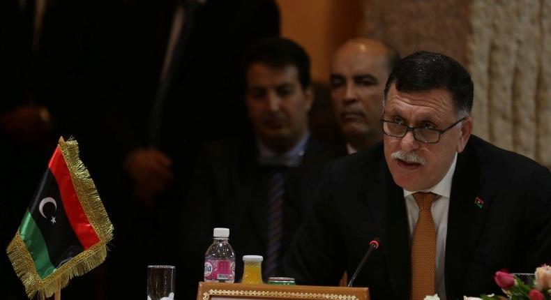 Libyan Prime Minister-designate Fayez Seraj speaks during the 8th ministerial meeting of Libya's neighbouring countries in Tunis, Tunisia March 22, 2016. 