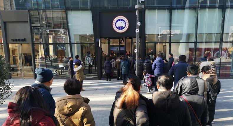 People line up to enter a Canada Goose flagship store at Sanlitun on December 30, 2018 in Beijing, China. Canada Goose opened its first flagship store in Beijing on Sunday.