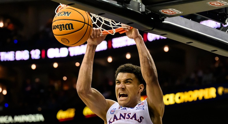 Kansas Jayhawks guard Kevin McCullar Jr. throws down a dunk during the 2023 Big 12 Tournament.AP Photo/Reed Hoffmann