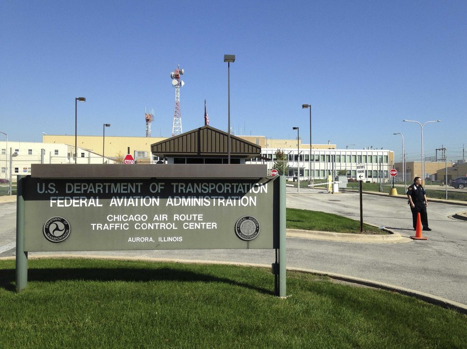 A police officer stands guard outside the FAA air traffic control center in Aurora, Illinois.