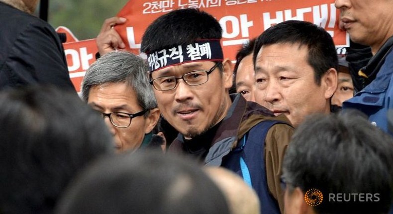 South Korea labour boss turns himself in weeks after violent rally