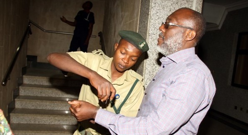 Olisa Metuh appears in an Abuja court in handcuffs on January 25, 2016